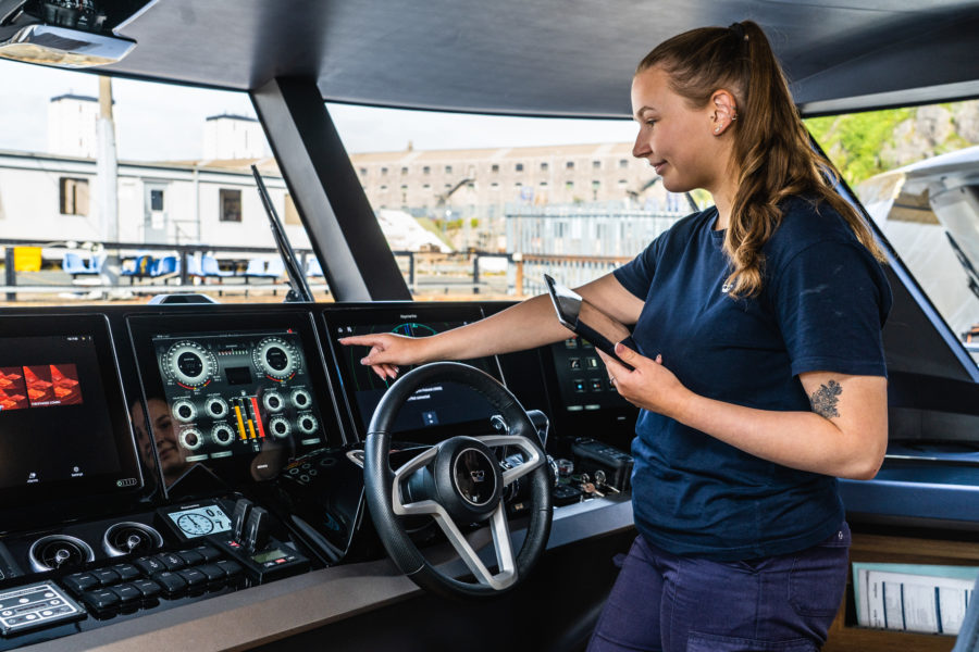 Female marine apprentice working on yacht at Princess Yachts
